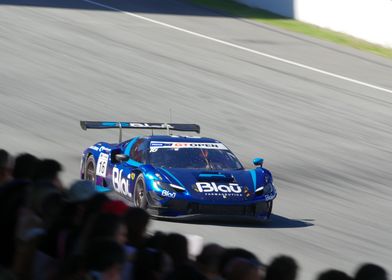 Ferrari 296 GT3 Blue Race Car on Track