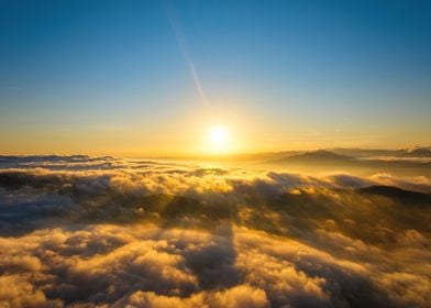 Golden Sunset Above Clouds