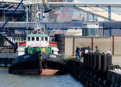 Tugboat Docked at Harbor