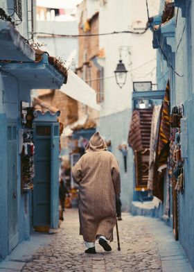 Man Walking in Moroccan Alley