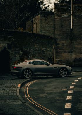 Jaguar Coupe on Cobblestone Street