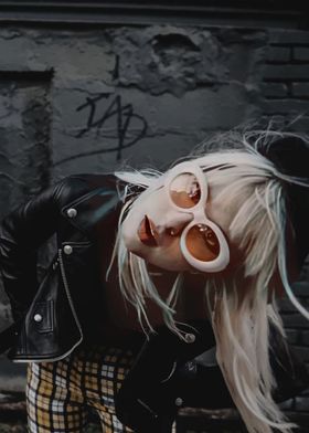 Woman in Leather Jacket and Sunglasses