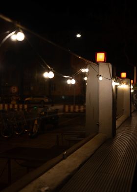 Fairy Lights on a Fence in the city