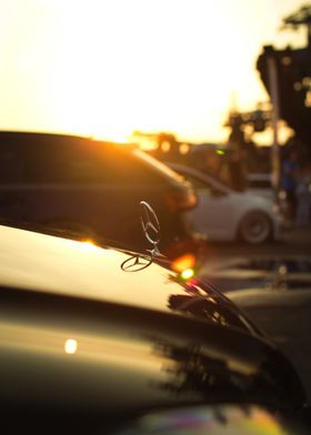 Mercedes Hood Emblem Sunset