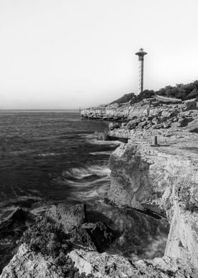 Lighthouse on Rocky Coast landscape sea