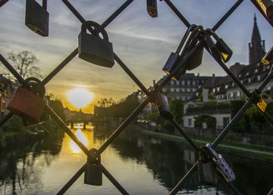 Love locks at sunset in the city of Strasbourg, France