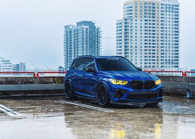 Blue BMW X5 in the Rain