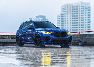 Blue BMW X5 in the Rain