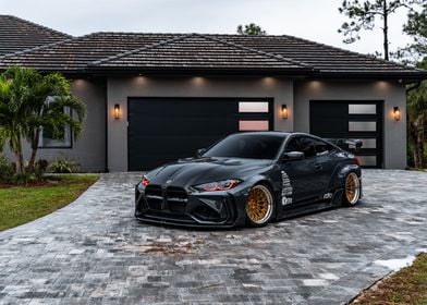 Black BMW M4 with Gold Rims