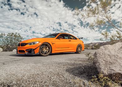 Orange BMW M4 with Gold Wheels