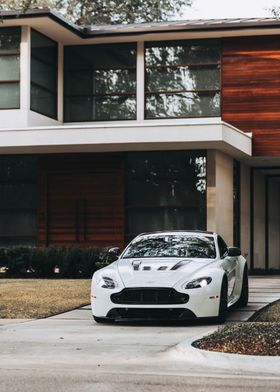 Aston Martin in Front of Modern House