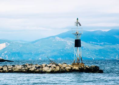 Lighthouse on Rocky Outcrop