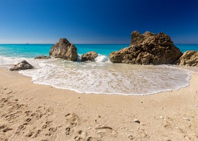 Sandy beach with rocks on the Greek island of Lafkada