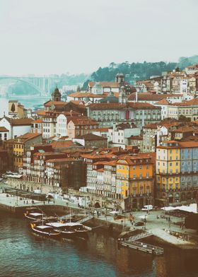 Porto aka Oporto, Portugal. Riverfront cityscape of the historical Ribeira District or Quarter and Rio Douro River aka Duero River. Unesco World Heritage Site. Picturesque old European cityscape showing a dense cluster of colorful historic buildings.