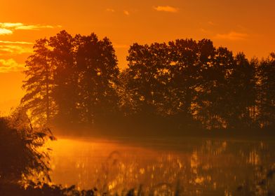 Autumn Sunrise over Still Water in the Lake