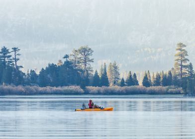 Kayaking on a Misty Lake