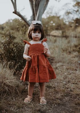 Little Girl in Rust Dress