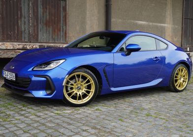 Blue Subaru BRZ with Gold Wheels