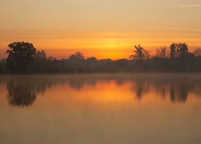 Sunrise Over Still Water