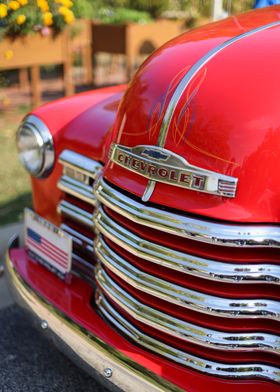 Classic Patriotic Red Chevrolet Truck American Flag and Flowers