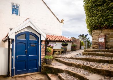 Cobblestone Pathway to Blue Door