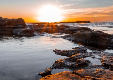 Sunset Over Rocky Coast