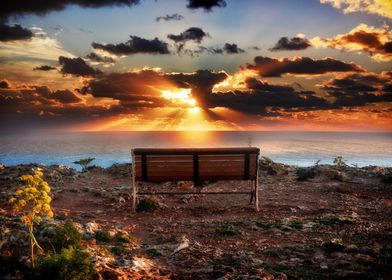 Sunset Infront of Lonely Bench on Cliffs in Malta