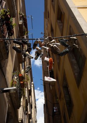 Shoes Hanging in Alley