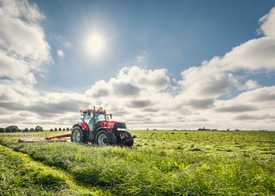 Case IH tractor mowing grass