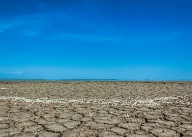 Cracked Earth Under Blue Sky