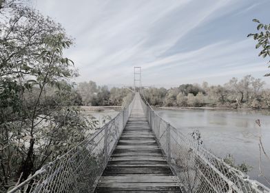 Suspension Bridge Over River