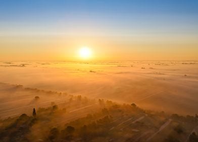 Sunrise Over Foggy Fields