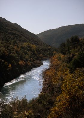 River Winding Through Mountains