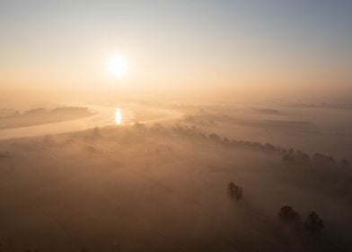 Sunrise Over Foggy River