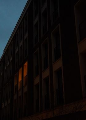 Single Lit Window in Dark Building