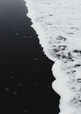 Black sand beach wave