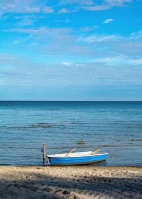 Blue Boat on Sandy Beach