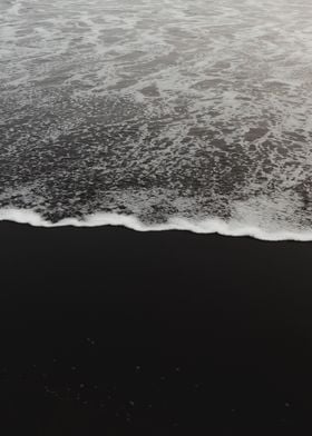 Black sand beach waves