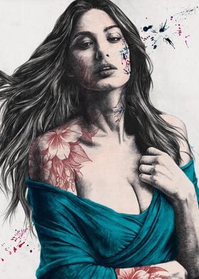 Woman drawing with floral tattoo