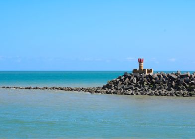 Lighthouse on a Rocky Outcrop