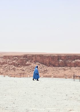 Man in Blue Robe in Desert