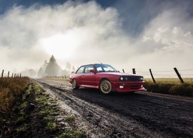 Red BMW E30 M3 on Country Road