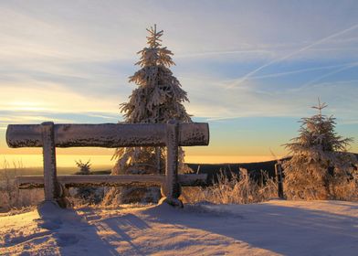 Snowy Bench at Sunset