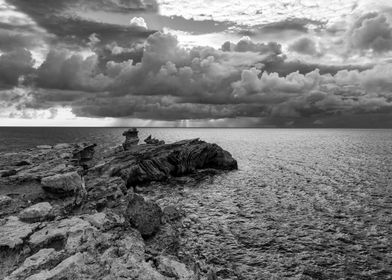 Rocky Coastline Under Stormy Sky