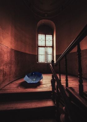 Blue Umbrella in Staircase