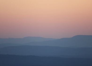 Silhouetted Mountains at Sunset