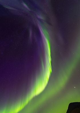 Dancing Lights: Aurora Borealis Over Arctic Peaks