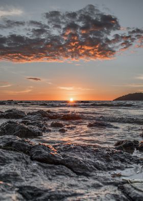 Sunset Over Rocky Shore