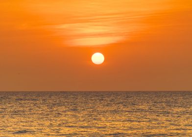 a circle, a bit of water,  some cloud brushes. The perfect sunset, only in Senegal