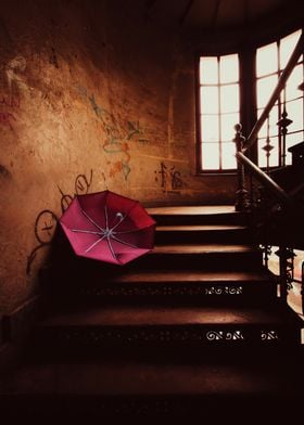 Red Umbrella on Old Stairs